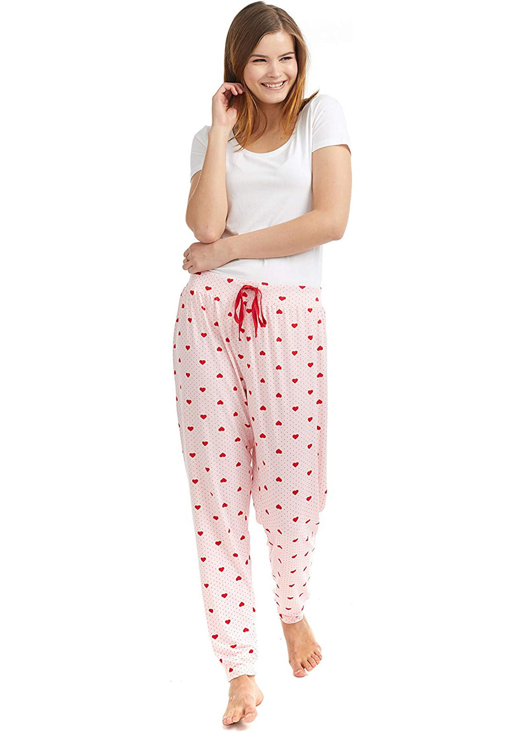 PJ joggers with soft velvety texture, stretch, elastic waistband, drawstring, and stylish ankle cuff. This pattern is small red hearts and dots, on a pink background