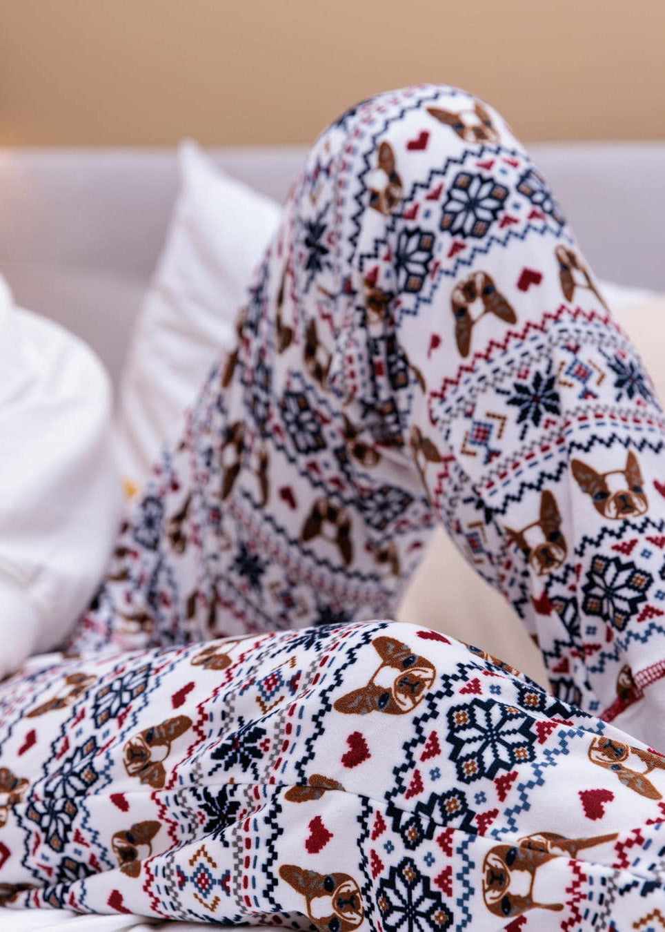PJ joggers with soft velvety texture, stretch, elastic waistband, drawstring, and stylish ankle cuff. This pattern is bulldog's head with pixelated heart and snowflake pattern.