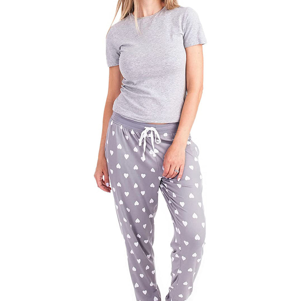 
                  
                    PJ joggers with soft velvety texture, stretch, elastic waistband, drawstring, and stylish ankle cuff. This pattern is white hearts on a grey background. The cuffs and the waist are matching grey.
                  
                