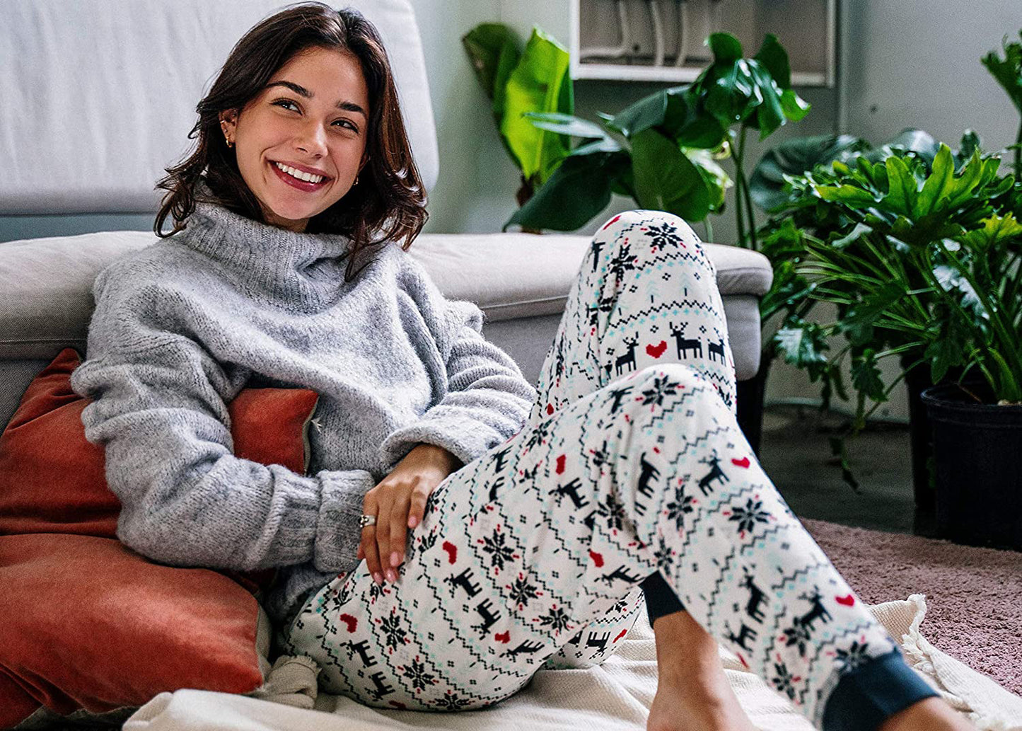 PJ joggers with soft velvety texture, stretch, elastic waistband, drawstring, and stylish ankle cuff. This pattern is deers with pixelated heart and snowflake pattern.