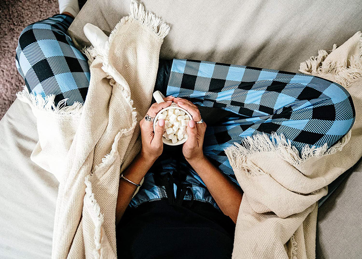 PJ joggers with soft velvety texture, stretch, elastic waistband, drawstring, and stylish ankle cuff. This pattern is plaid black and blue.