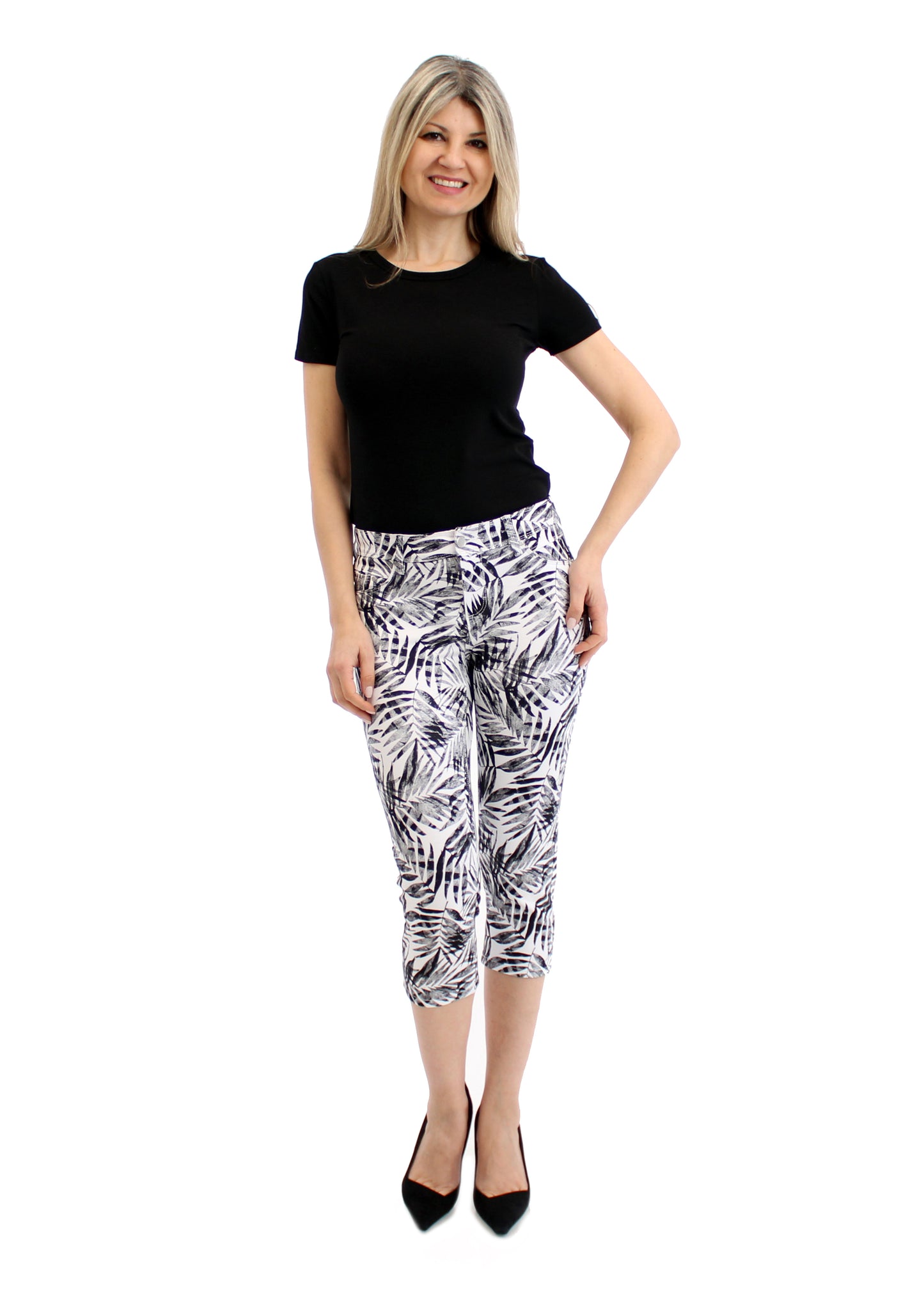 
                  
                    Women's Mid Rise Black Leaves Printed Stretch Capris
                  
                