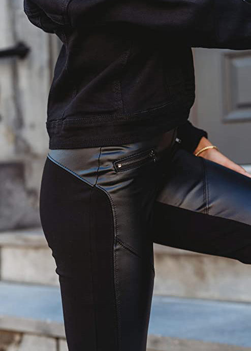 
                  
                    Black Suko Jeans Ponte Leggings for Women with faux leather front, angled zippered pockets. this picture shows the side of the garment, showring the curved side of the faux leather
                  
                