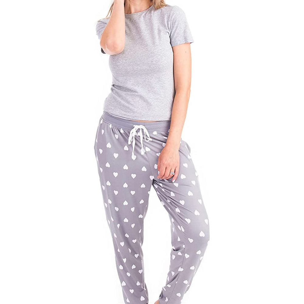 PJ joggers with soft velvety texture, stretch, elastic waistband, drawstring, and stylish ankle cuff. This pattern is white hearts on a grey background. The cuffs and the waist are matching grey.