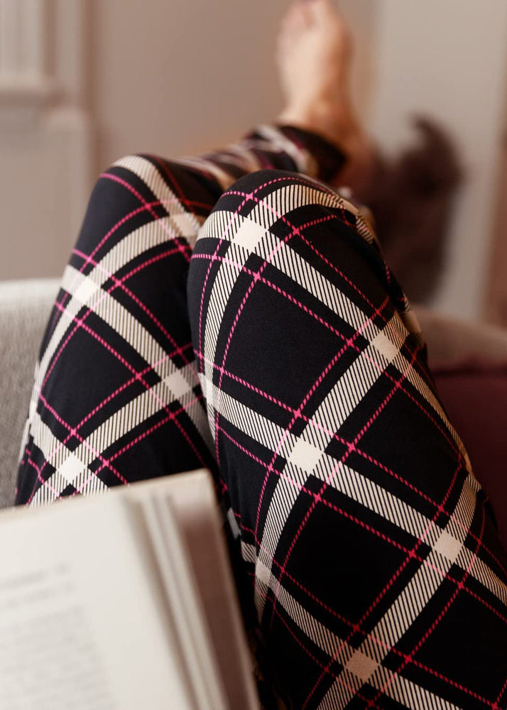 
                  
                    PJ joggers with soft velvety texture, stretch, elastic waistband, drawstring, and stylish ankle cuff. This pattern is a navy plaid with white and red lines.  it also features a red drawstring.
                  
                