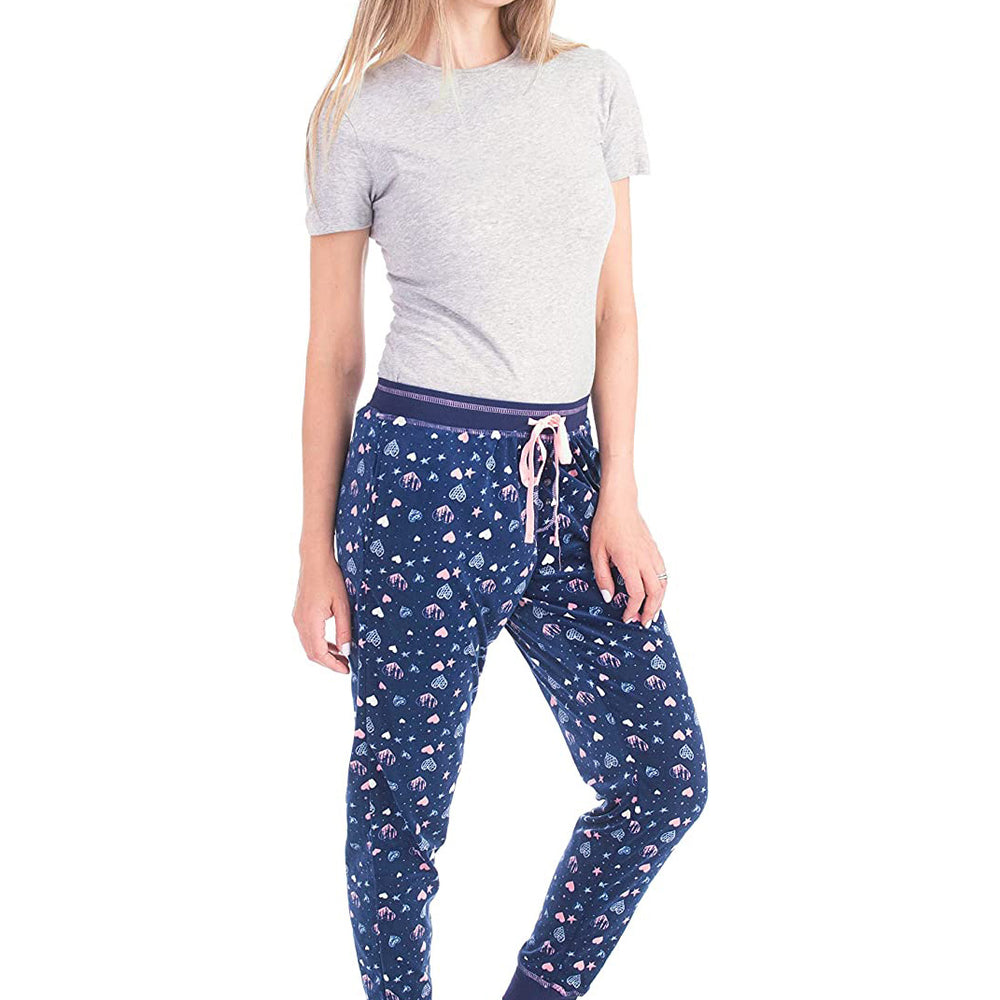 
                  
                    PJ joggers with soft velvety texture, stretch, elastic waistband, drawstring, and stylish ankle cuff. This pattern is a light blue, light pink hearts and starts on a navy background. It features a pink drawstring.
                  
                