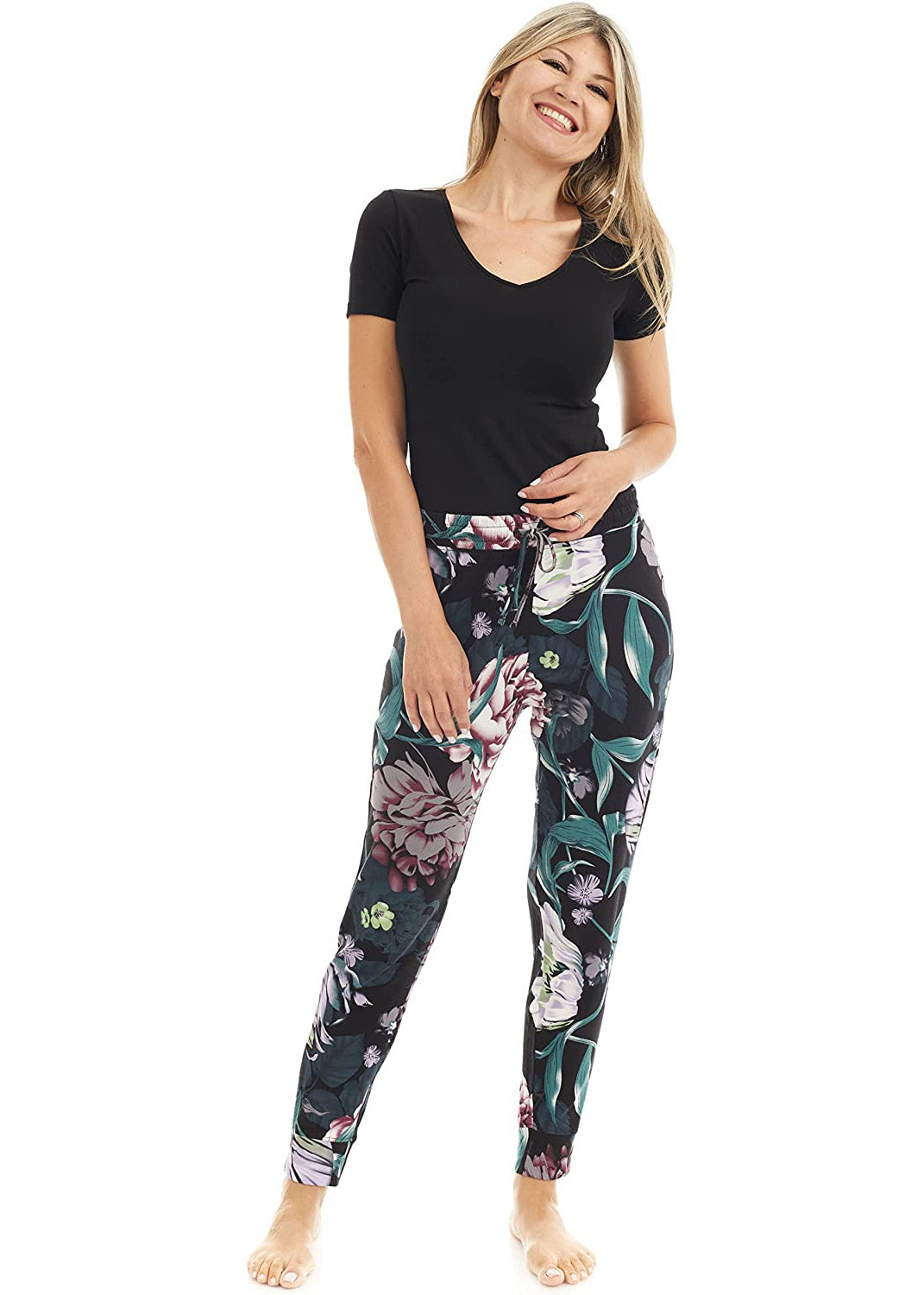 Bamboo wide-leg pyjama bottoms with elastic waistband, drawstring, and open bottom leg. flower pattern, main colors are green, purple, white, red.