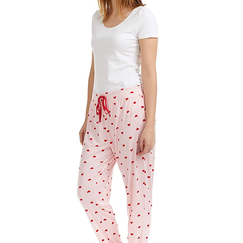
                  
                    PJ joggers with soft velvety texture, stretch, elastic waistband, drawstring, and stylish ankle cuff. This pattern is small red hearts and dots, on a pink background
                  
                
