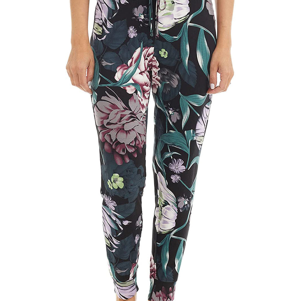 Bamboo wide-leg pyjama bottoms with elastic waistband, drawstring, and open bottom leg. flower pattern, main colors are green, purple, white, red, on black background