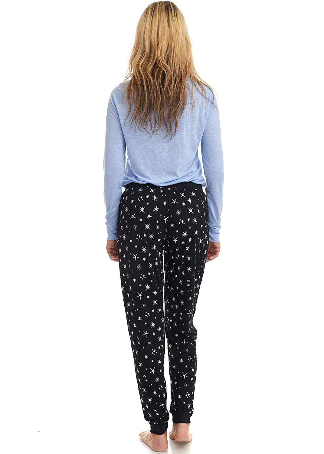 
                  
                    PJ joggers with soft velvety texture, stretch, elastic waistband, drawstring, and stylish ankle cuff. This pattern is scattered stars, of varied size and shape, white, on black stars on a black background.
                  
                
