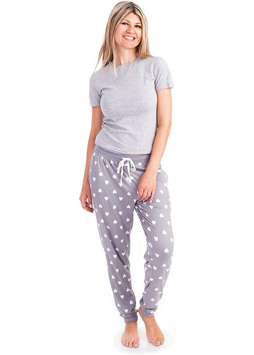 
                  
                    PJ joggers with soft velvety texture, stretch, elastic waistband, drawstring, and stylish ankle cuff. This pattern is white hearts on a grey background. The cuffs and the waist are matching grey.
                  
                