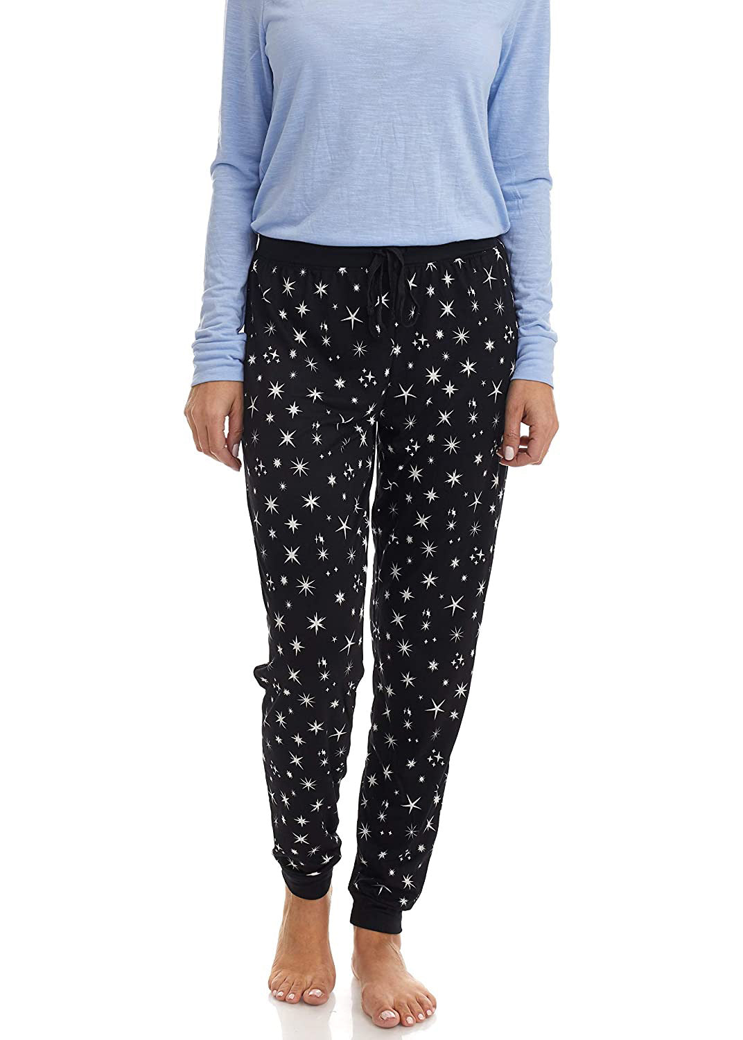 PJ joggers with soft velvety texture, stretch, elastic waistband, drawstring, and stylish ankle cuff. This pattern is scattered stars, of varied size and shape, white, on black stars on a black background.