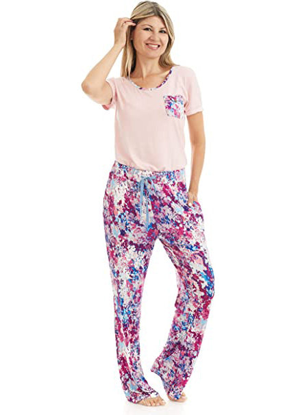 T Shirt and Pant Pajama set. The t-shirt is solid light pink. it has a pocket and a neck trim that matches the pattern on the pants. the pattern on the pants is a pink, white and blue flower pattern.